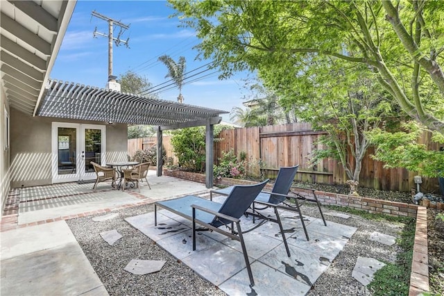 view of patio featuring a pergola, a fenced backyard, and french doors