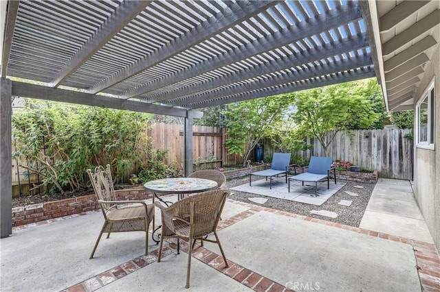 view of patio / terrace featuring a pergola, a fenced backyard, and outdoor dining space