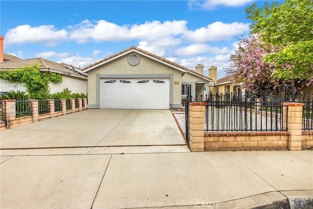916 Award Dr, Colton, CA 92324 - single story home featuring stucco siding, driveway, an attached garage, a fenced front yard, and a tile roof