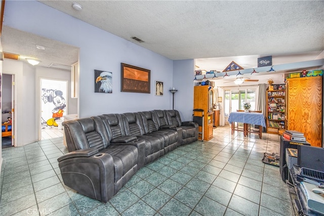 916 Award Dr, Colton, CA 92324 - living room featuring a textured ceiling and tile patterned floors