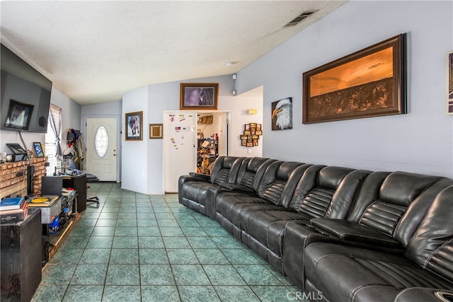 916 Award Dr, Colton, CA 92324 - living room featuring lofted ceiling and a textured ceiling