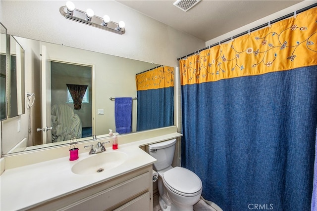 916 Award Dr, Colton, CA 92324 - bathroom with toilet, vanity, and a shower with shower curtain