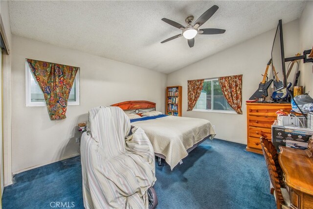 916 Award Dr, Colton, CA 92324 - carpeted bedroom featuring vaulted ceiling, a textured ceiling, and a ceiling fan