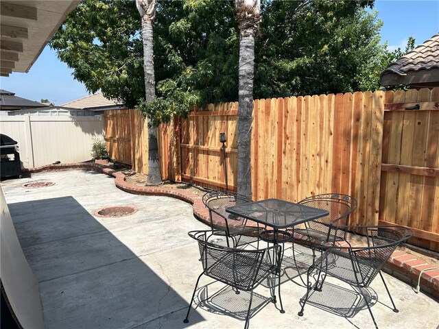 916 Award Dr, Colton, CA 92324 - fenced backyard featuring a patio area and outdoor dining area