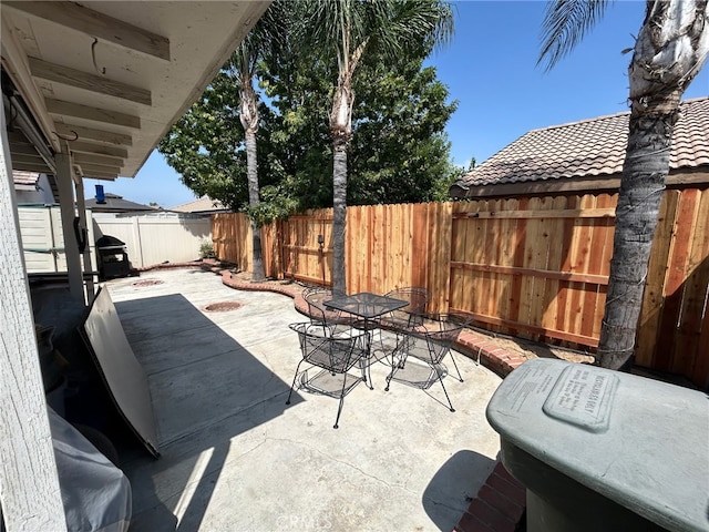 916 Award Dr, Colton, CA 92324 - fenced backyard featuring outdoor dining space and a patio