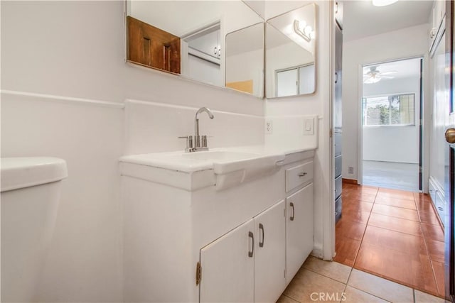 bathroom featuring a ceiling fan, vanity, and tile patterned floors