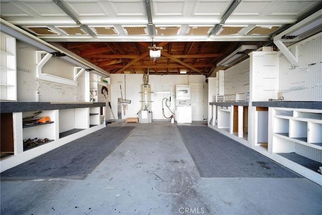 73203 Sun Valley Dr Unit 29, Palms, CA 92277 - garage with a garage door opener and a workshop area