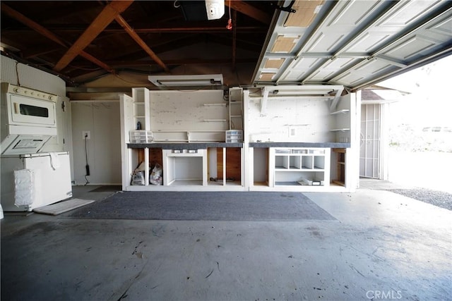 73203 Sun Valley Dr Unit 29, Palms, CA 92277 - garage featuring estacked washer and dryer