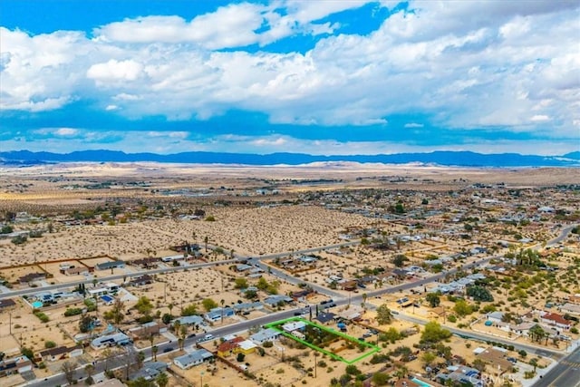 73203 Sun Valley Dr Unit 29, Palms, CA 92277 - aerial view of property and surrounding area with mountains and property parcel outlined