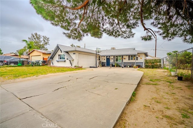 1924 Hunter Rd, Colton, CA 92324 - view of front facade with a garage and driveway