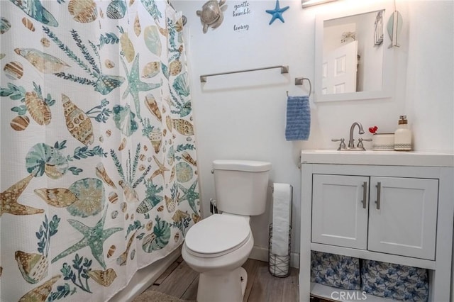 1924 Hunter Rd, Colton, CA 92324 - bathroom with vanity, wood finished floors, and a shower with shower curtain