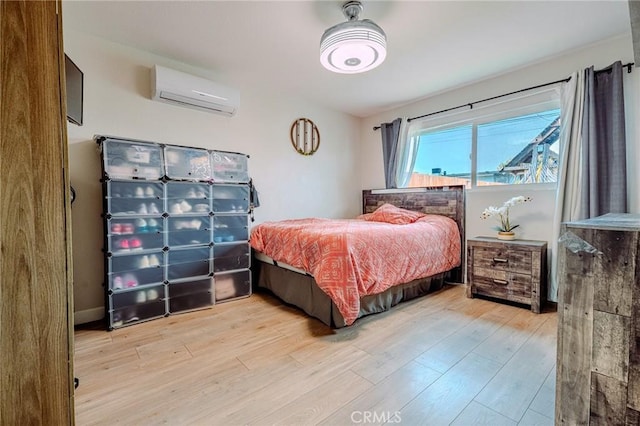 1924 Hunter Rd, Colton, CA 92324 - bedroom with an AC wall unit and light wood-type flooring
