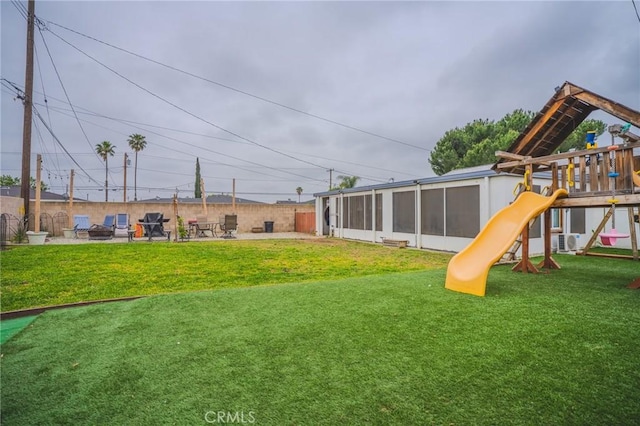 1924 Hunter Rd, Colton, CA 92324 - view of yard featuring a playground and a sunroom