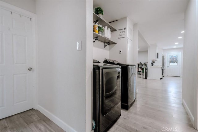 1924 Hunter Rd, Colton, CA 92324 - washroom with washing machine and clothes dryer and light wood-style floors