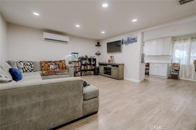 1924 Hunter Rd, Colton, CA 92324 - living area with a wall mounted AC, light wood-style flooring, and recessed lighting