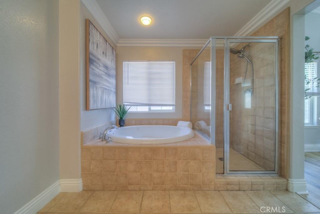 bathroom with tile patterned flooring, a bath, a wealth of natural light, and a shower stall