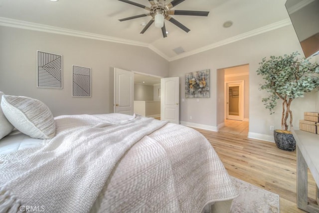 bedroom with ornamental molding, lofted ceiling, baseboards, light wood-type flooring, and a ceiling fan