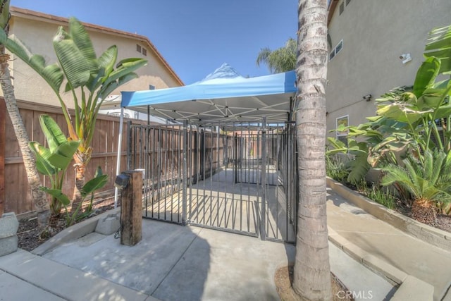 view of gate featuring fence