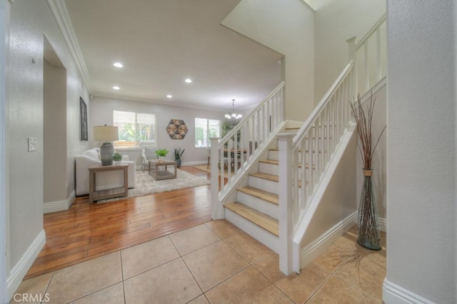 staircase with crown molding, tile patterned flooring, baseboards, a chandelier, and recessed lighting