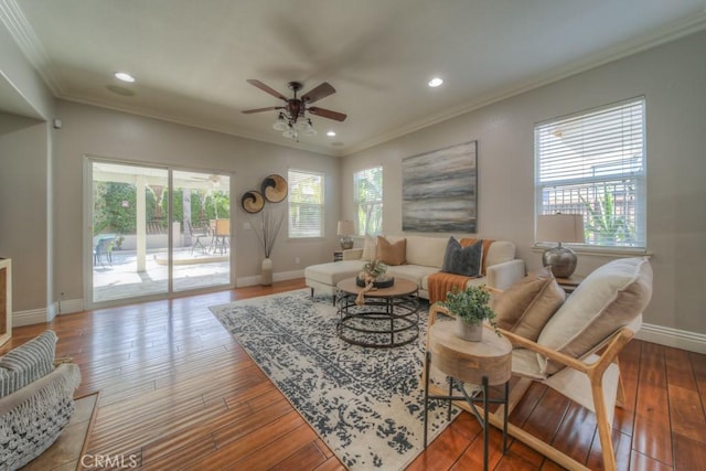 living room with a ceiling fan, baseboards, recessed lighting, wood finished floors, and ornamental molding