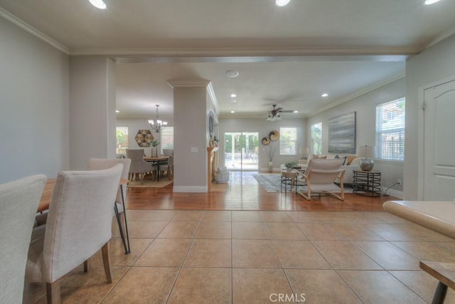 dining area featuring crown molding, recessed lighting, a wealth of natural light, and light tile patterned floors