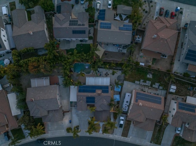 birds eye view of property with a residential view