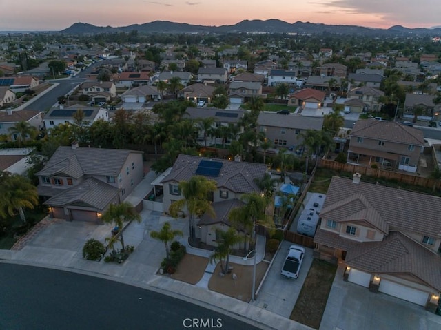 drone / aerial view with a residential view and a mountain view