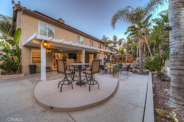 view of patio / terrace with a ceiling fan and outdoor dining space