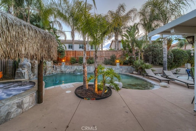 view of pool with a fenced in pool, a fenced backyard, and a patio area