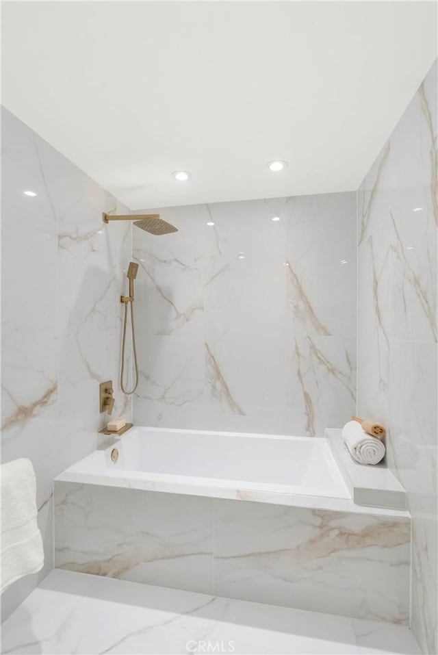 bathroom featuring a combined bath / shower with marble appearance, recessed lighting, tile walls, and marble finish floor