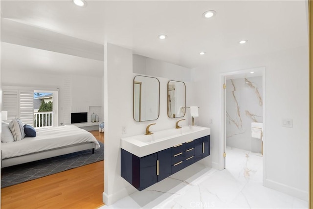 full bathroom with recessed lighting, a marble finish shower, connected bathroom, and double vanity