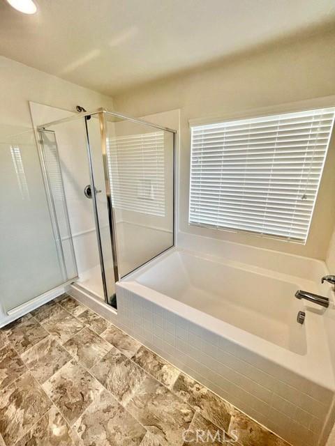 2819 La Calle Sabio Ave, Rosamond, CA 93560 - full bath with a stall shower and a garden tub