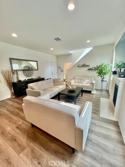 2819 La Calle Sabio Ave, Rosamond, CA 93560 - living area with light wood finished floors and recessed lighting