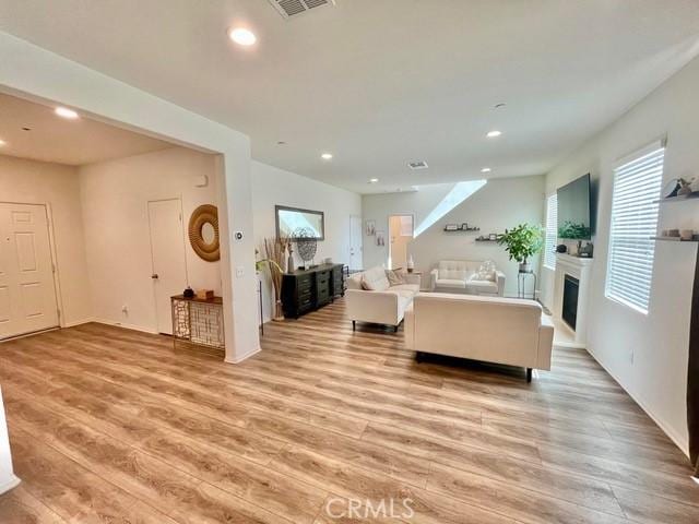 2819 La Calle Sabio Ave, Rosamond, CA 93560 - living area with recessed lighting, light wood-style floors, and a fireplace