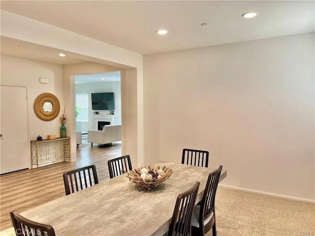 2819 La Calle Sabio Ave, Rosamond, CA 93560 - dining area with a fireplace, recessed lighting, and baseboards