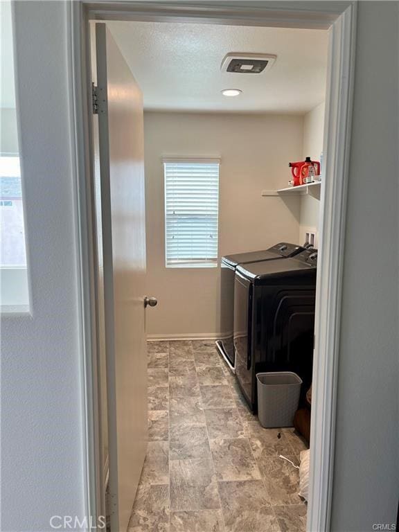 2819 La Calle Sabio Ave, Rosamond, CA 93560 - washroom with washing machine and dryer and baseboards