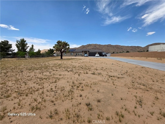 24236 Cahuilla Rd, Apple Valley, CA 92307 - view of yard featuring a mountain view and concrete driveway