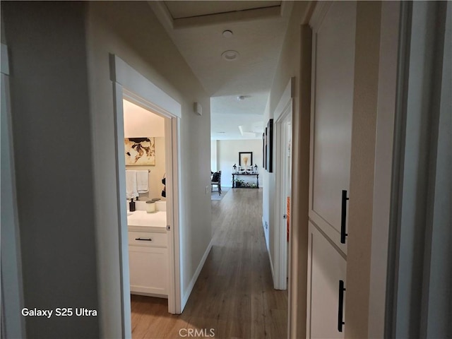 24236 Cahuilla Rd, Apple Valley, CA 92307 - hallway with light wood finished floors and baseboards