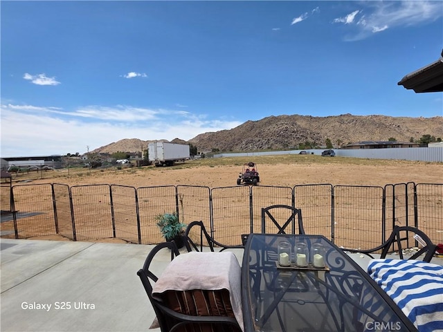24236 Cahuilla Rd, Apple Valley, CA 92307 - view of patio / terrace featuring a mountain view and outdoor dining area