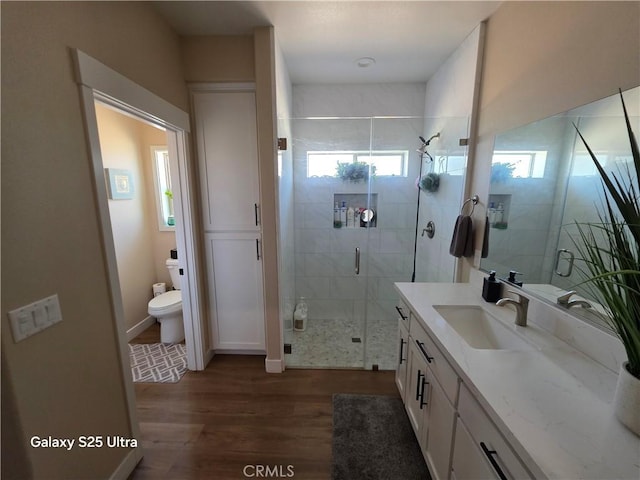 24236 Cahuilla Rd, Apple Valley, CA 92307 - full bath featuring plenty of natural light, wood finished floors, vanity, and toilet