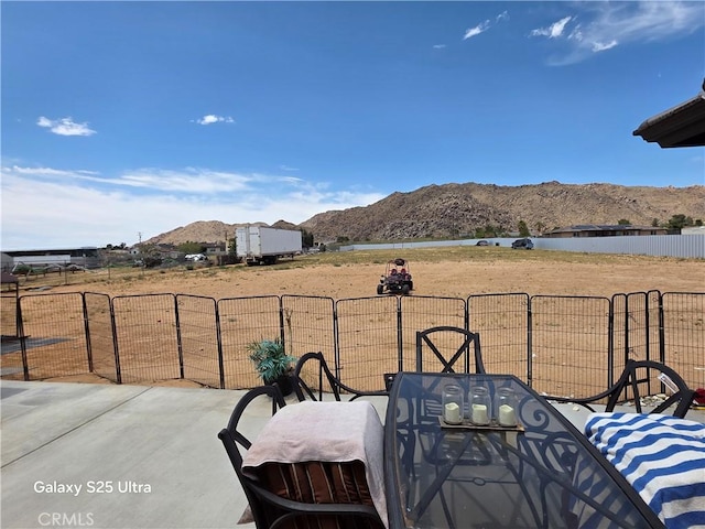 24236 Cahuilla Rd, Apple Valley, CA 92307 - view of patio featuring a mountain view and outdoor dining area
