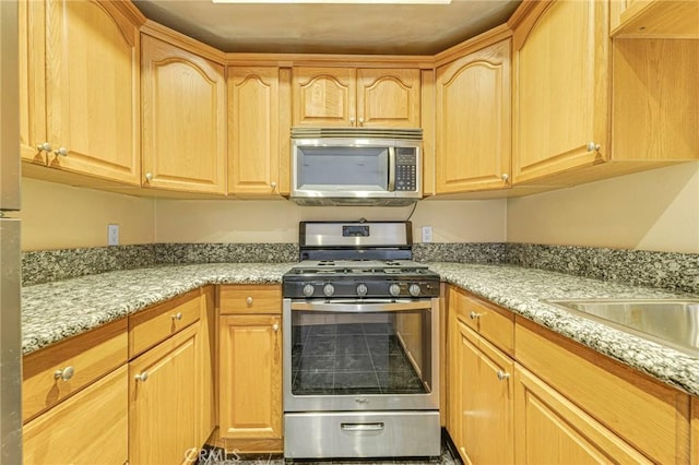 630 E Acacia Ave Unit 6, Glendale, CA 91205 - kitchen with light brown cabinets, light stone countertops, and stainless steel appliances