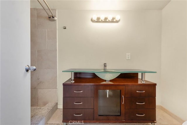 630 E Acacia Ave Unit 6, Glendale, CA 91205 - bathroom featuring baseboards, vanity, and tiled shower
