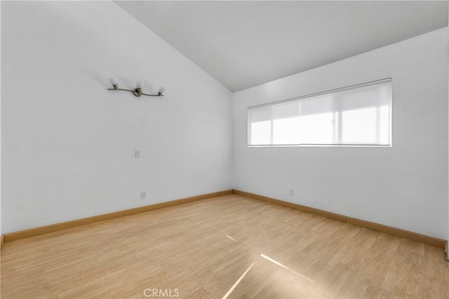 630 E Acacia Ave Unit 6, Glendale, CA 91205 - empty room featuring light wood-style floors, baseboards, and vaulted ceiling