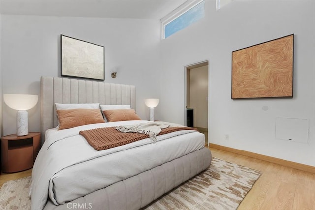 630 E Acacia Ave Unit 6, Glendale, CA 91205 - bedroom with baseboards, high vaulted ceiling, and wood finished floors