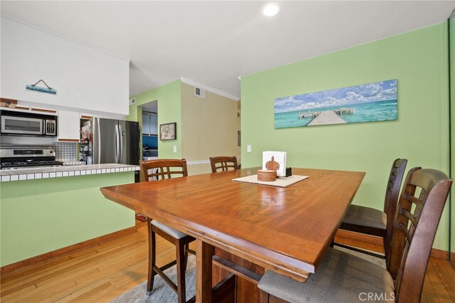 11 Northwind Ct Unit 41, Newport Beach, CA 92663 - dining space with light wood-style floors and recessed lighting