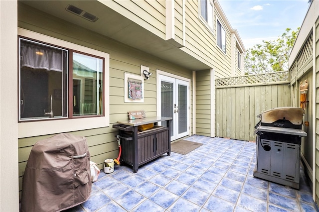 11 Northwind Ct Unit 41, Newport Beach, CA 92663 - view of patio featuring french doors and a grill