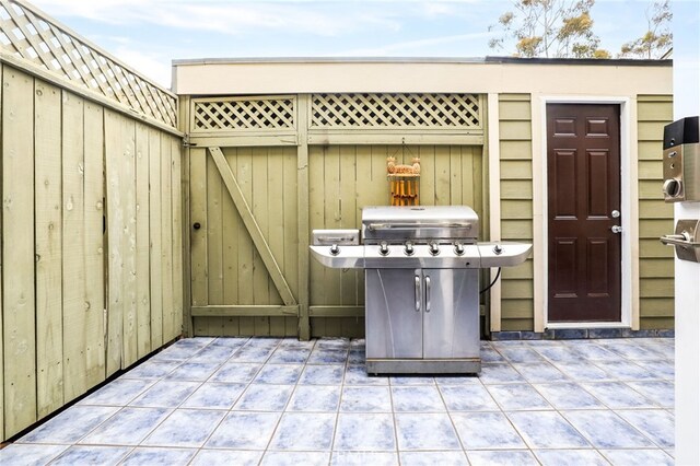 11 Northwind Ct Unit 41, Newport Beach, CA 92663 - view of patio featuring a grill and a gate