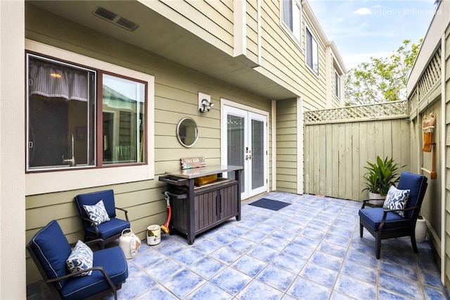 11 Northwind Ct Unit 41, Newport Beach, CA 92663 - view of patio featuring french doors