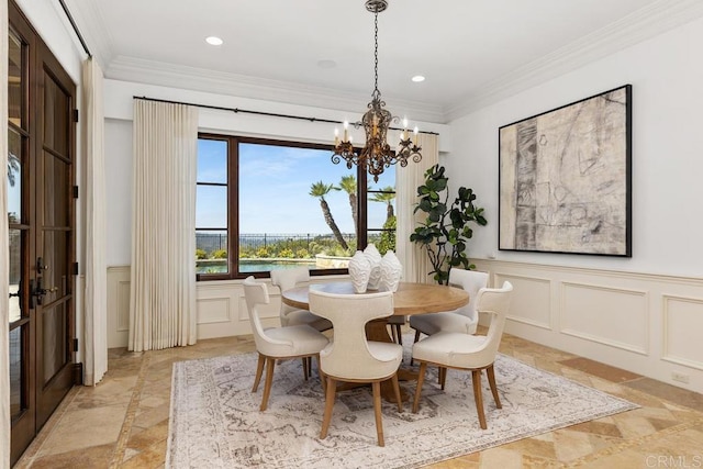 5015 Rancho Quinta Bnd, San Diego, CA 92130 - dining space with a decorative wall, a chandelier, stone tile flooring, crown molding, and recessed lighting